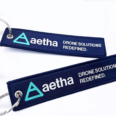 Φαστική υφασμένη ύφασμα αλυσίδα κλειδιών patch κενό Διπλό πλευρικό κεντημένο Jet Tag εξατομικευμένο κέντημα keychain